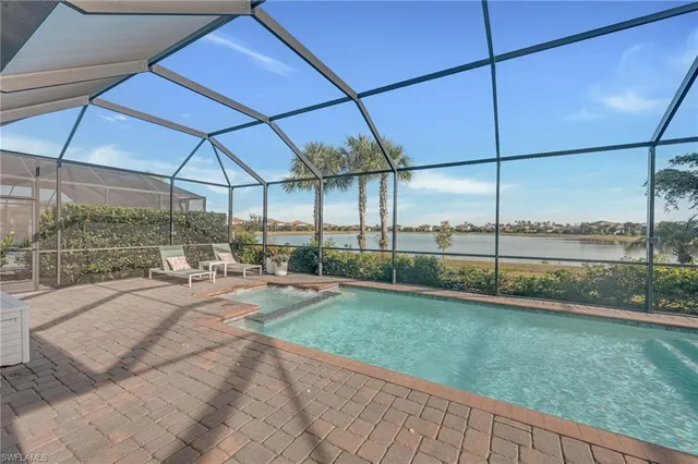 a view of an house with backyard and porch