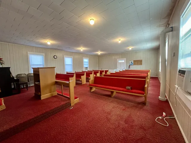 a living room with furniture a dining table and kitchen view