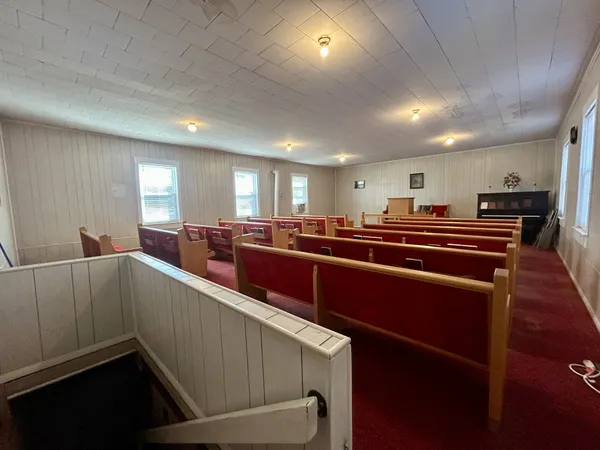 a room with lots of furniture and windows