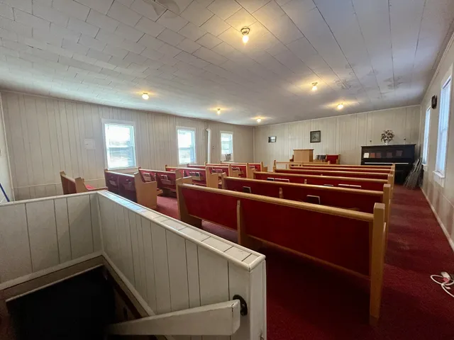 a room with lots of furniture and windows