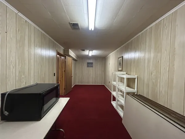 a bathroom with a sink a toilet and shower curtain
