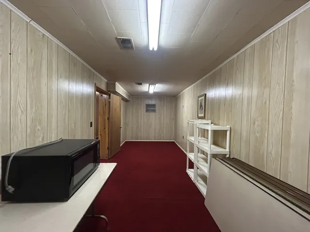 a bathroom with a sink a toilet and shower curtain
