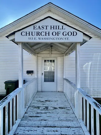 a front view of a house with stairs