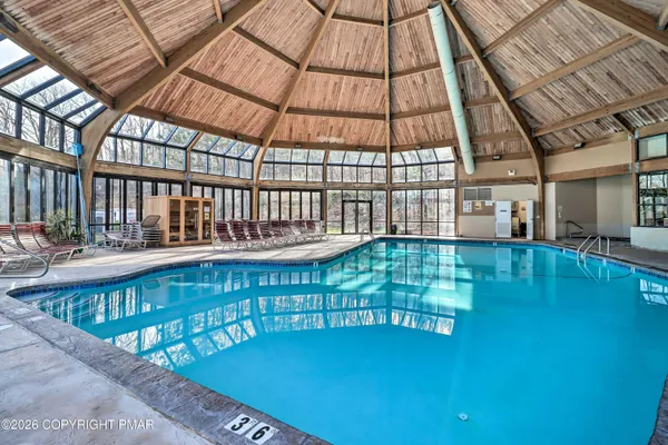 a view of swimming pool with seating space