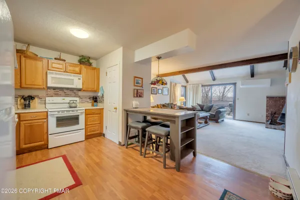 a kitchen with a stove a sink and a refrigerator