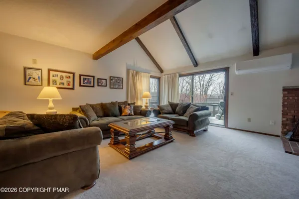 a living room with furniture and a large window