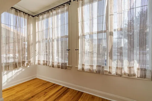 a view of a room with a large window and a shower