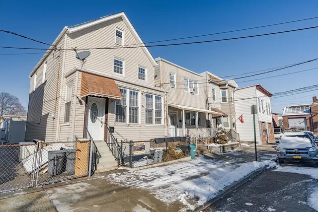 a view of a blue house with outdoor space