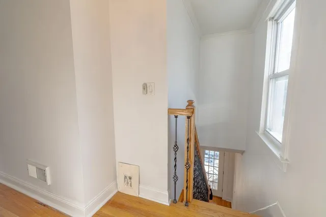 wooden floor in an empty room and a window