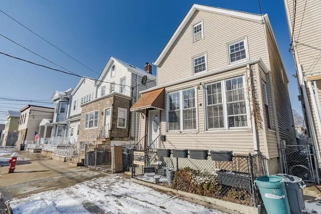 a front view of a house with large windows