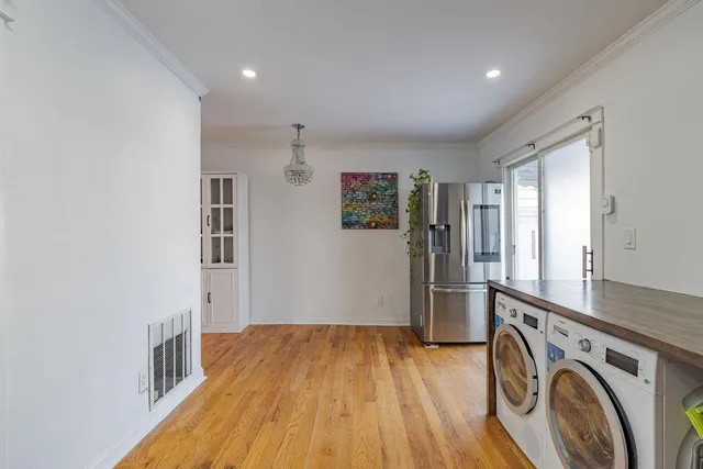 a view of a storage & utility room with closet window