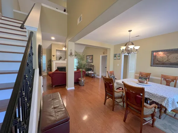 a view of a livingroom with furniture and a chandelier
