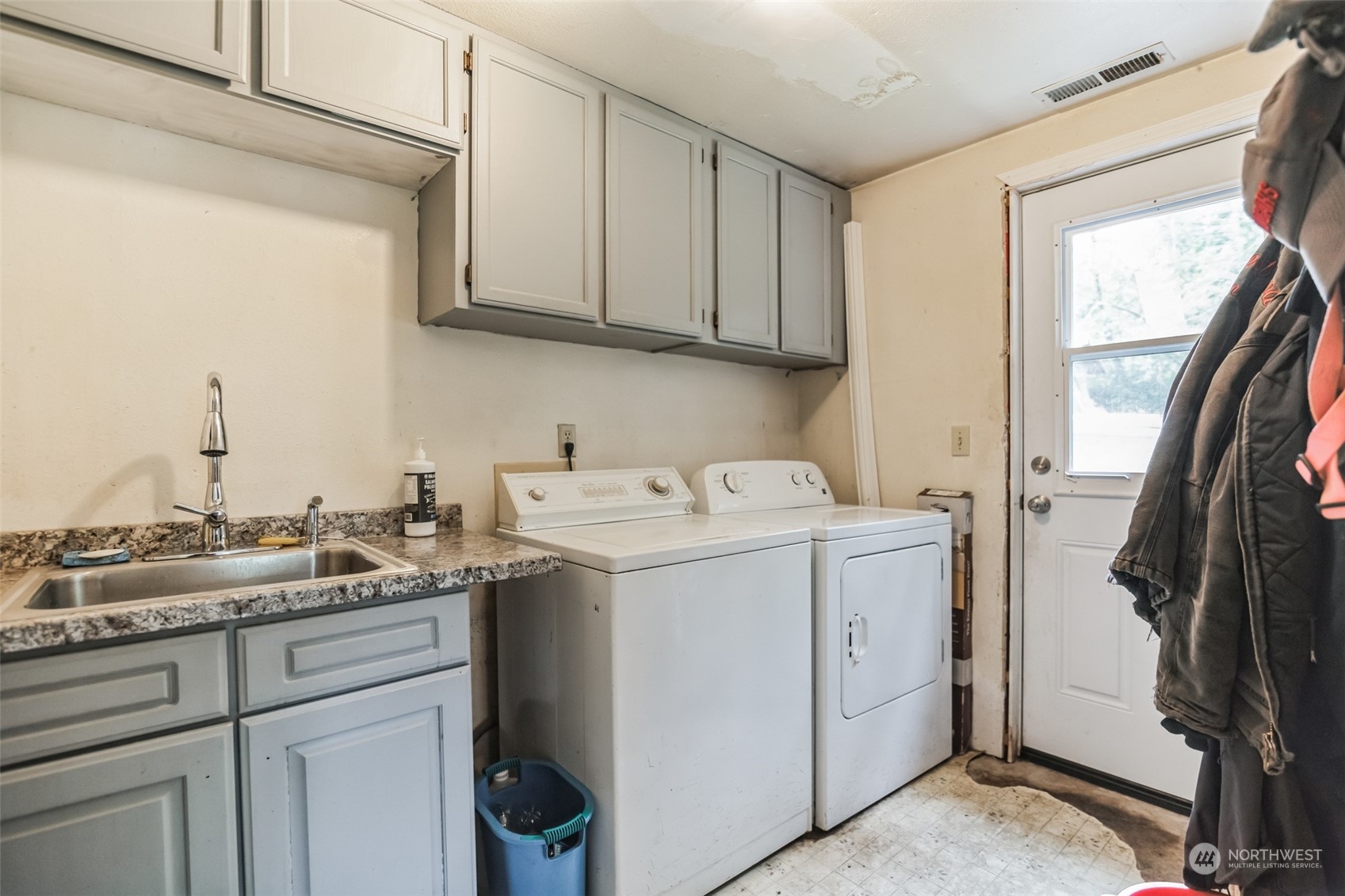 22824 7th Avenue Southeast Bothell, WA 98021 - Photo 11 of 21 a utility room with cabinets washer and dryer