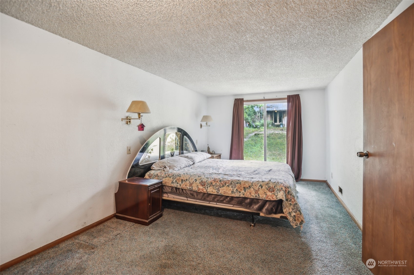 22824 7th Avenue Southeast Bothell, WA 98021 - Photo 12 of 21 a bed sitting in a bedroom next to a window