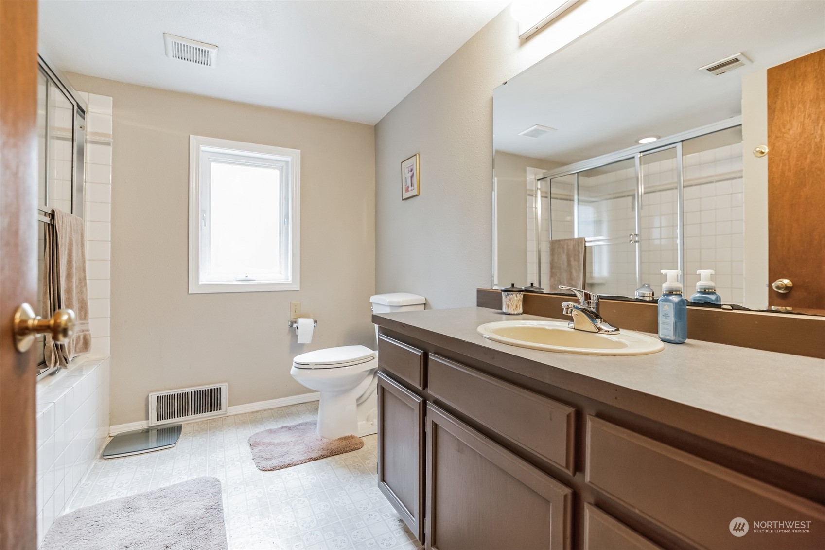 22824 7th Avenue Southeast Bothell, WA 98021 - Photo 14 of 21 a bathroom with a double vanity sink toilet and a mirror