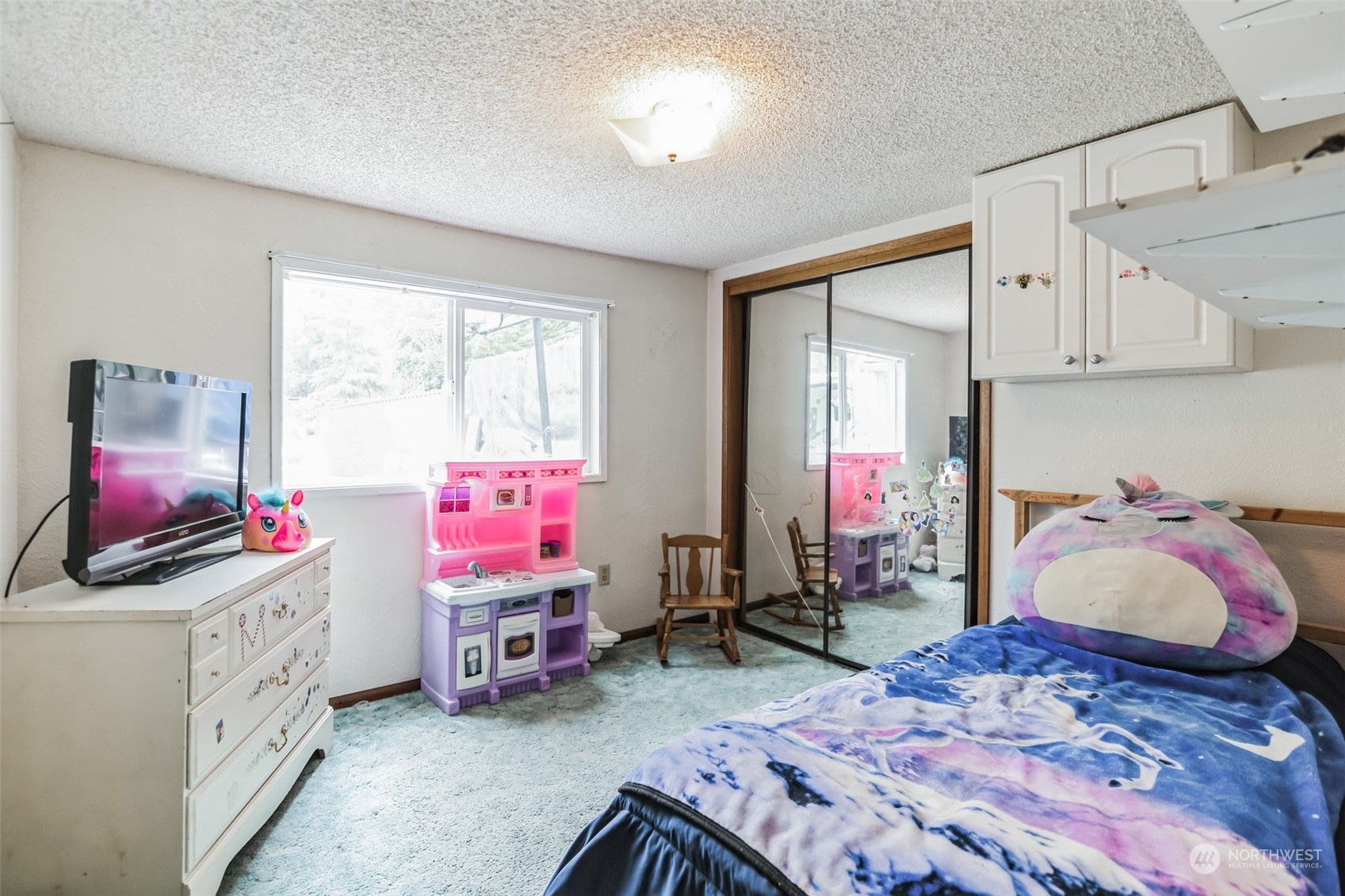 22824 7th Avenue Southeast Bothell, WA 98021 - Photo 16 of 21 a bedroom with bed and a flat screen tv