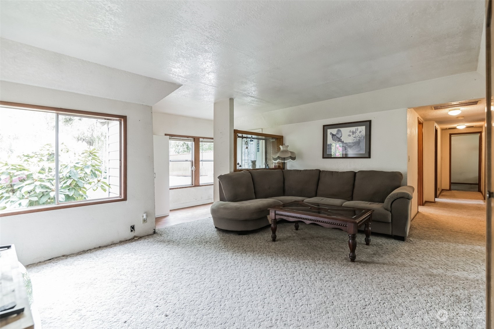 22824 7th Avenue Southeast Bothell, WA 98021 - Photo 5 of 21 a living room with furniture and a large window