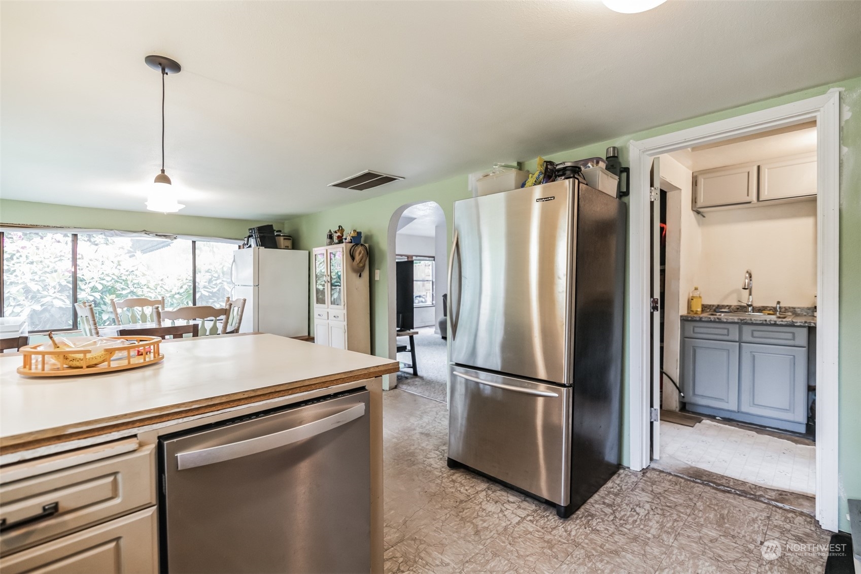 22824 7th Avenue Southeast Bothell, WA 98021 - Photo 8 of 21 a kitchen with stainless steel appliances a refrigerator and a sink