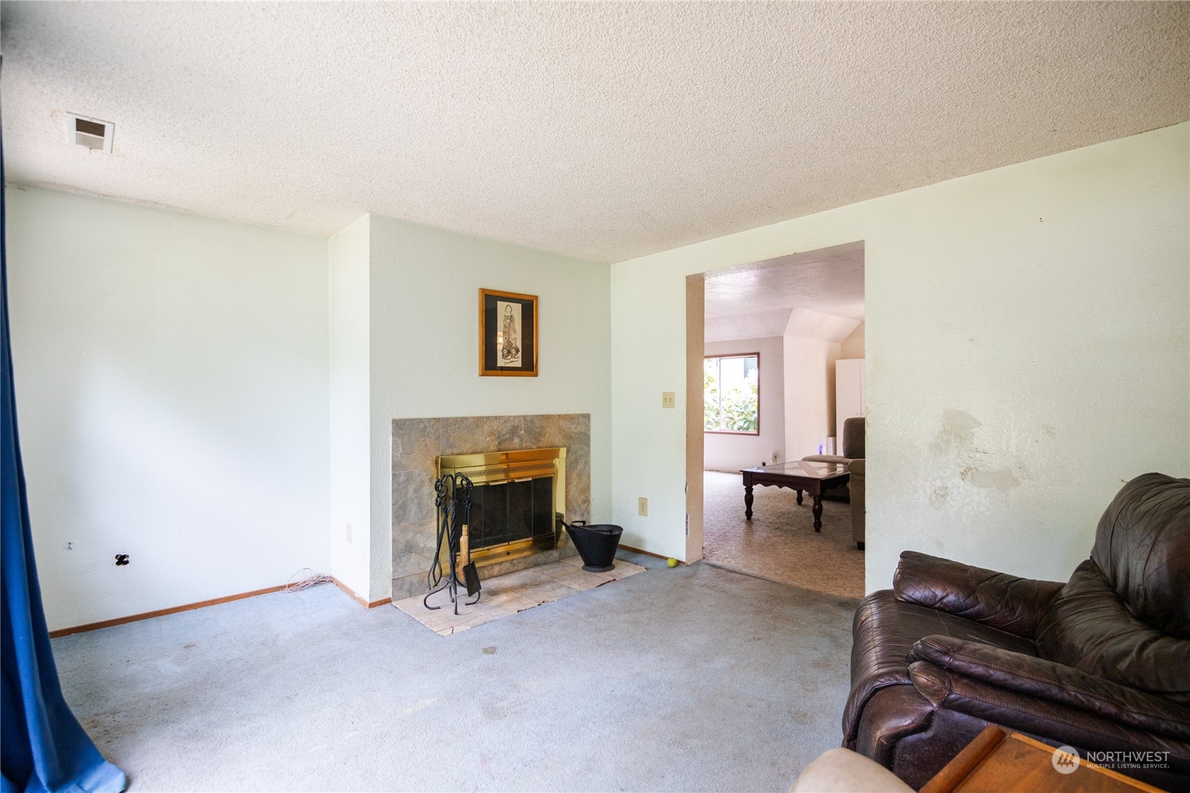 22824 7th Avenue Southeast Bothell, WA 98021 - Photo 9 of 21 a living room with furniture and a fireplace