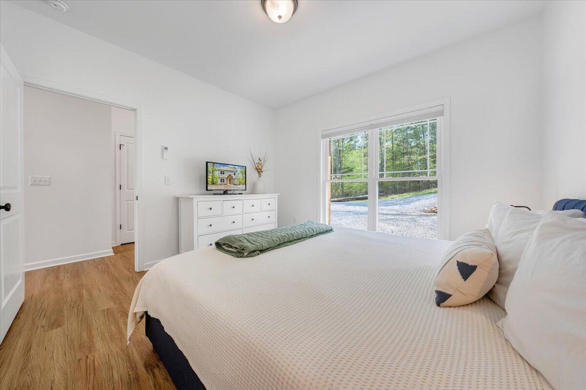 1373 Thomason Lane Goodview, VA 24095 - Photo 13 of 89 a bedroom with a bed and a window
