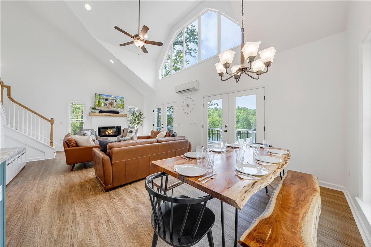 1373 Thomason Lane Goodview, VA 24095 - Photo 15 of 89 a view of a dining room with furniture a chandelier and wooden floor