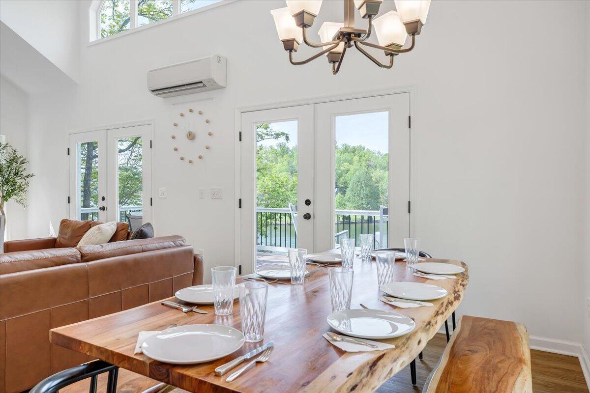 1373 Thomason Lane Goodview, VA 24095 - Photo 17 of 89 a view of a dining room with furniture wooden floor and chandelier