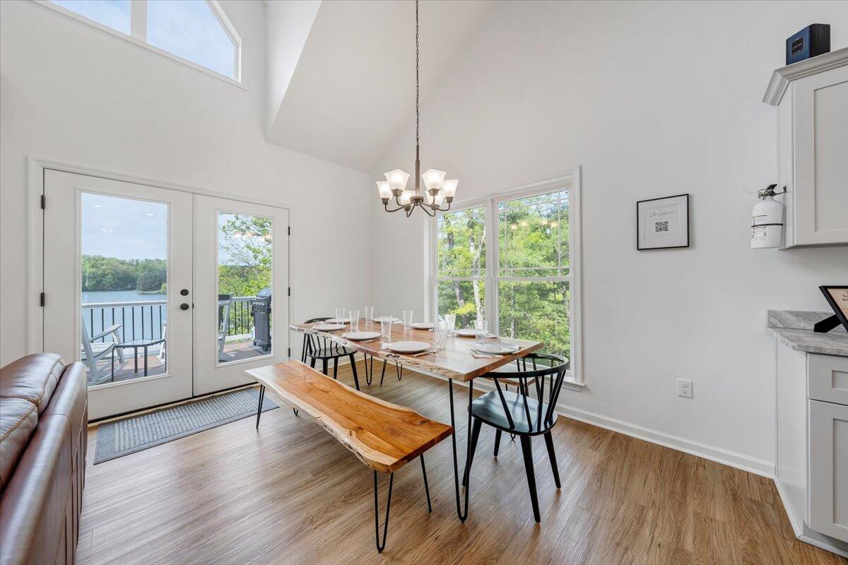 1373 Thomason Lane Goodview, VA 24095 - Photo 18 of 89 a dining room with furniture a chandelier and wooden floor