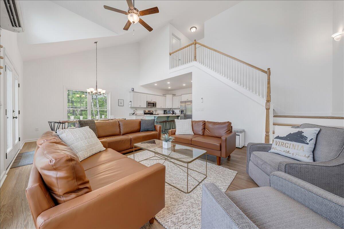1373 Thomason Lane Goodview, VA 24095 - Photo 24 of 89 a living room with furniture and a chandelier