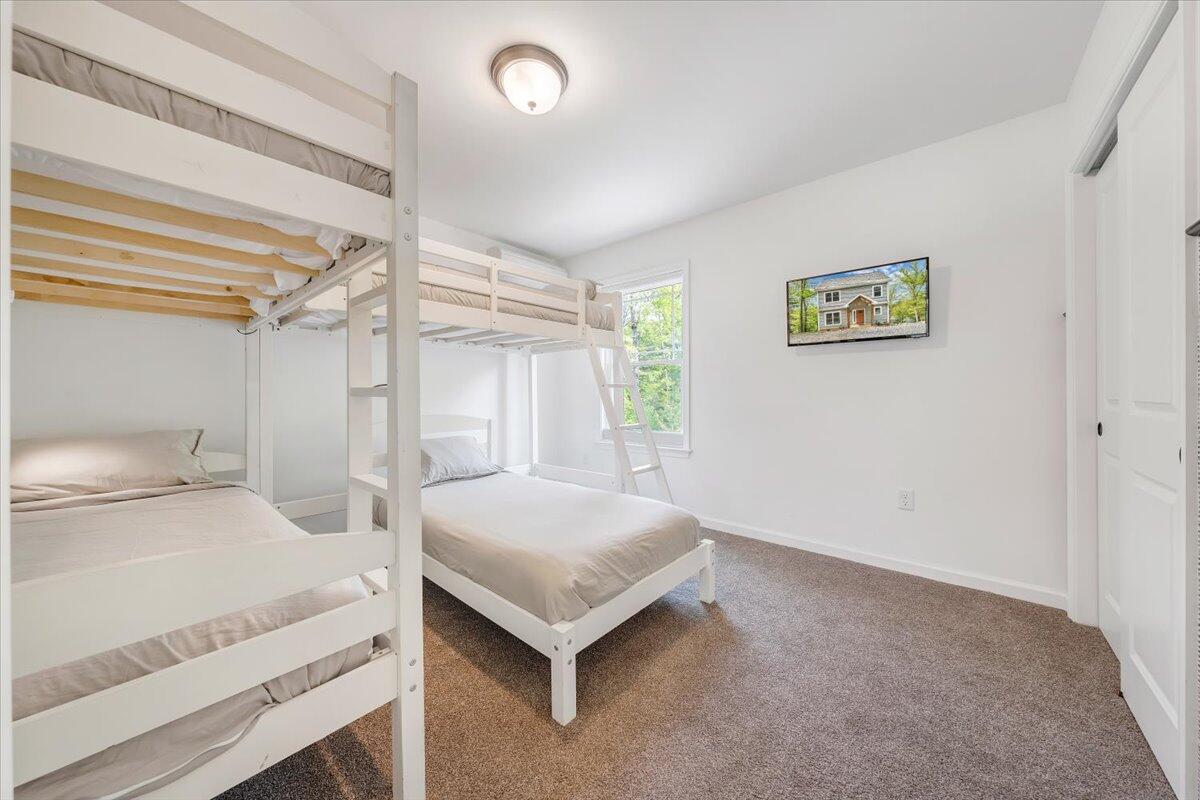 1373 Thomason Lane Goodview, VA 24095 - Photo 30 of 89 a bedroom with a bed and a table