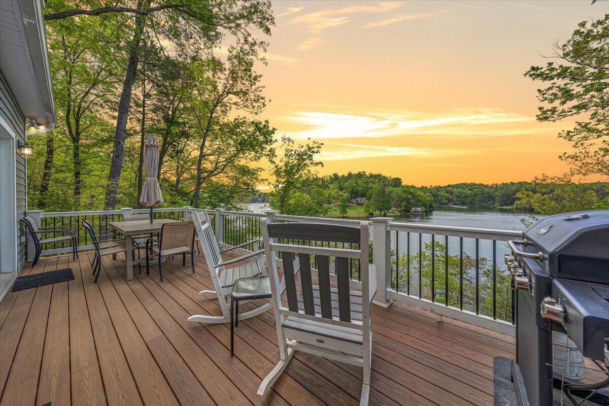 1373 Thomason Lane Goodview, VA 24095 - Photo 4 of 89 a view of a deck with chairs wooden floor and fence
