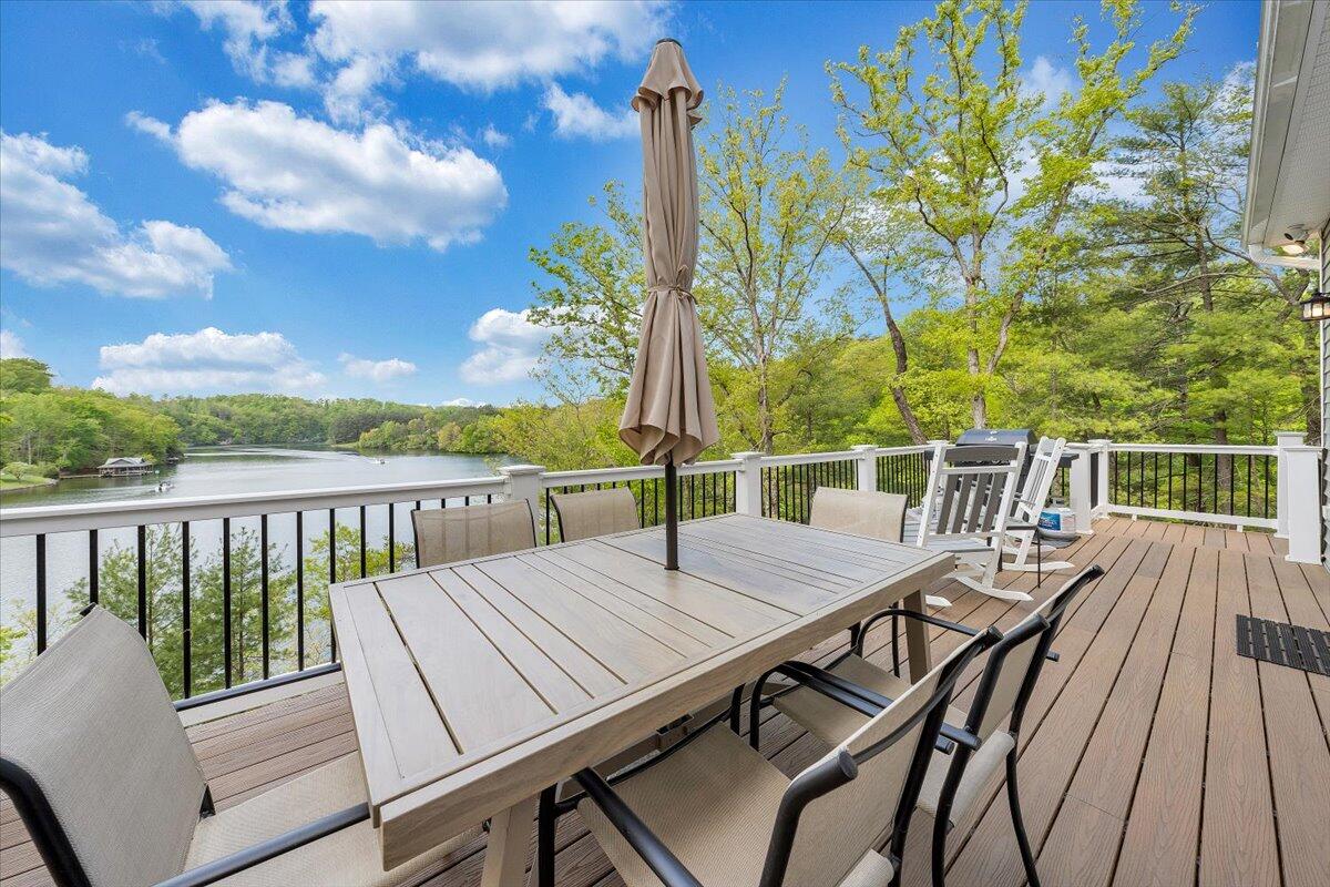 1373 Thomason Lane Goodview, VA 24095 - Photo 43 of 89 a balcony with wooden floor table and chairs