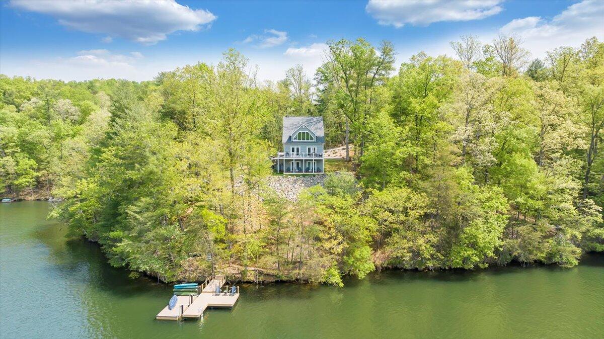 1373 Thomason Lane Goodview, VA 24095 - Photo 65 of 89 a view of a lake with a house in the background