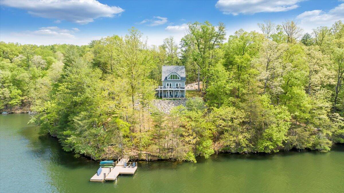 1373 Thomason Lane Goodview, VA 24095 - Photo 66 of 89 a view of a lake with a house in the background
