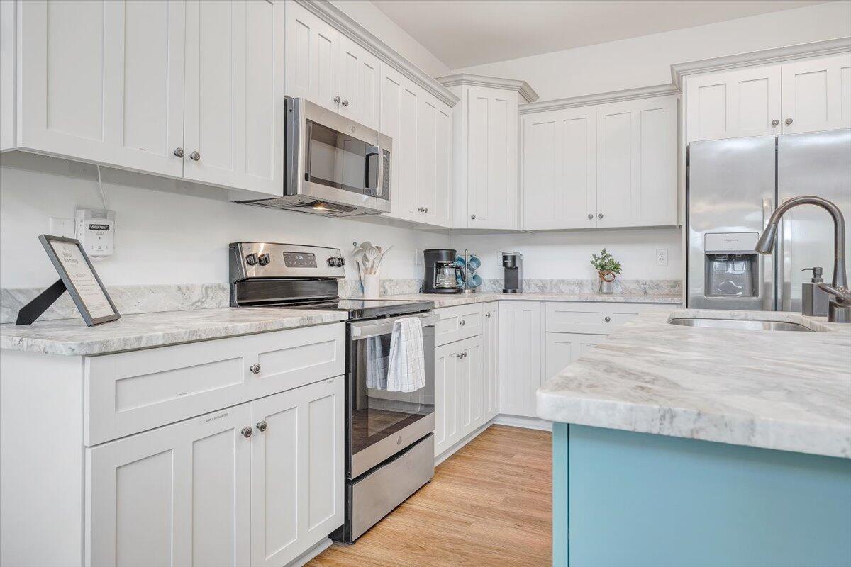 1373 Thomason Lane Goodview, VA 24095 - Photo 10 of 89 a kitchen with cabinets appliances a sink and a counter space