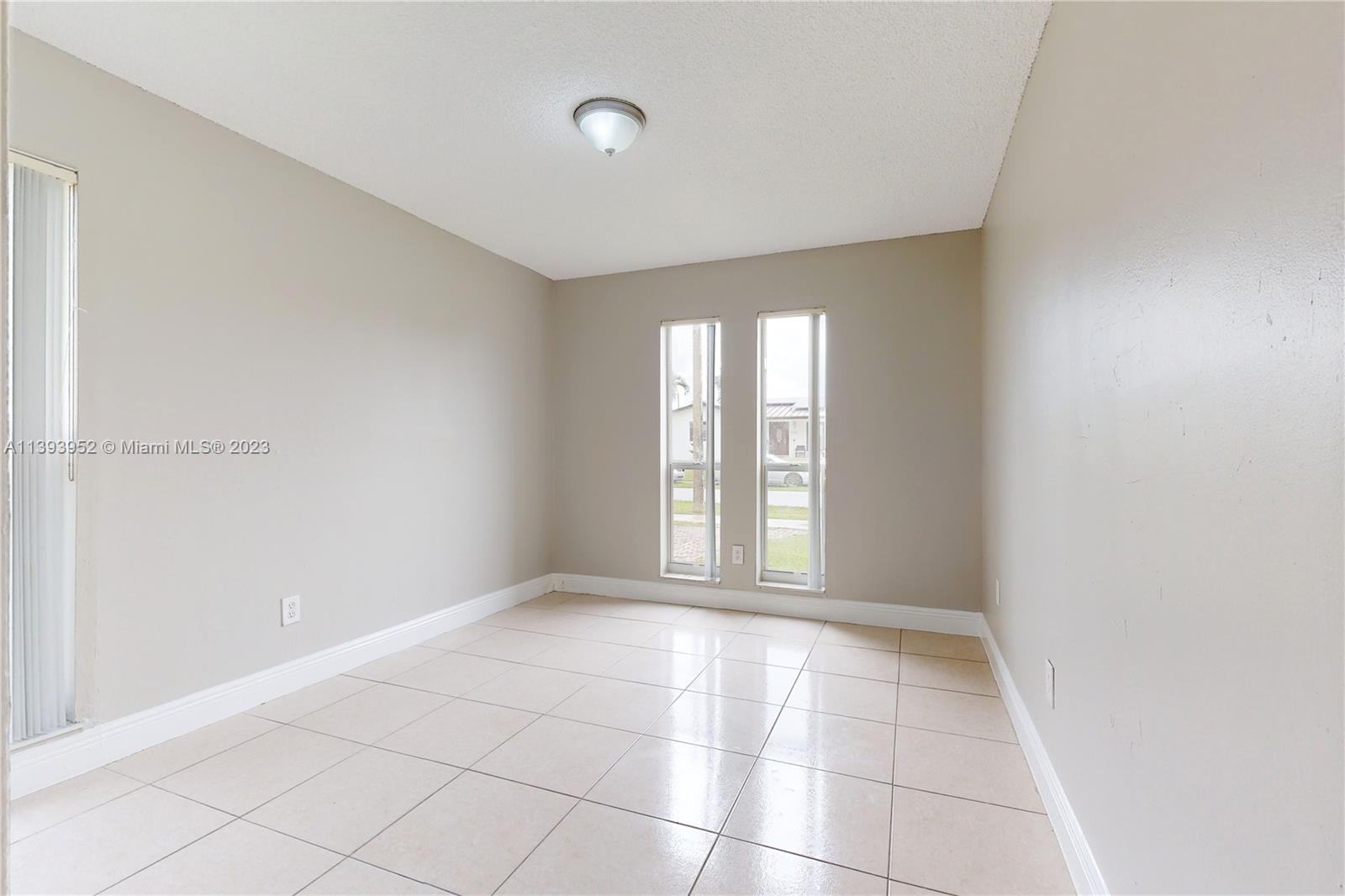 16813 Southwest 107th Place Miami, FL 33157 - Photo 15 of 28 a view of an empty room with a window