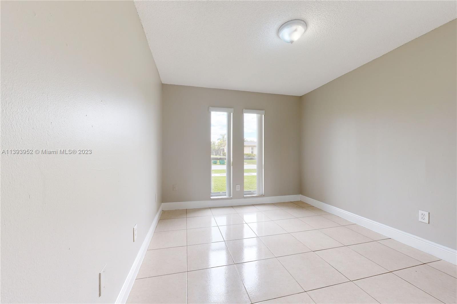 16813 Southwest 107th Place Miami, FL 33157 - Photo 16 of 28 a view of an empty room with a window