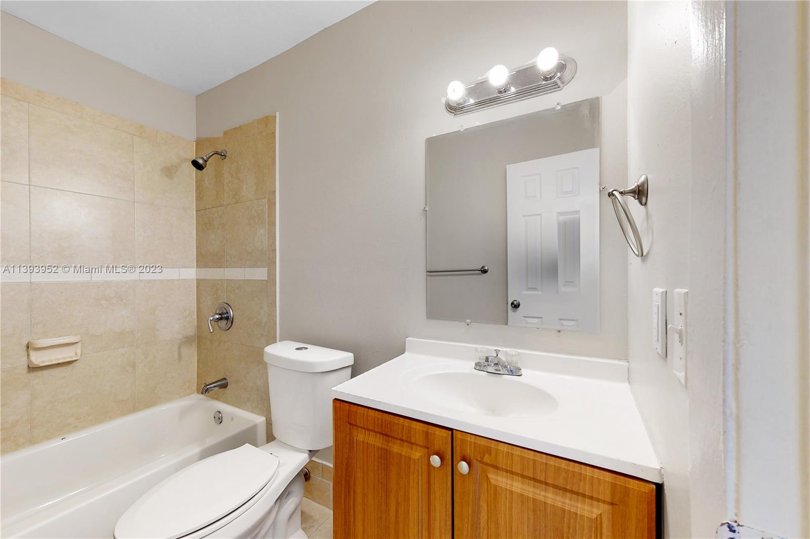 16813 Southwest 107th Place Miami, FL 33157 - Photo 17 of 28 a bathroom with a sink a toilet and shower