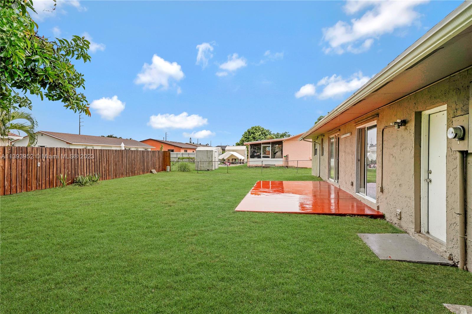 16813 Southwest 107th Place Miami, FL 33157 - Photo 21 of 28 a view of backyard with swimming pool and outdoor seating