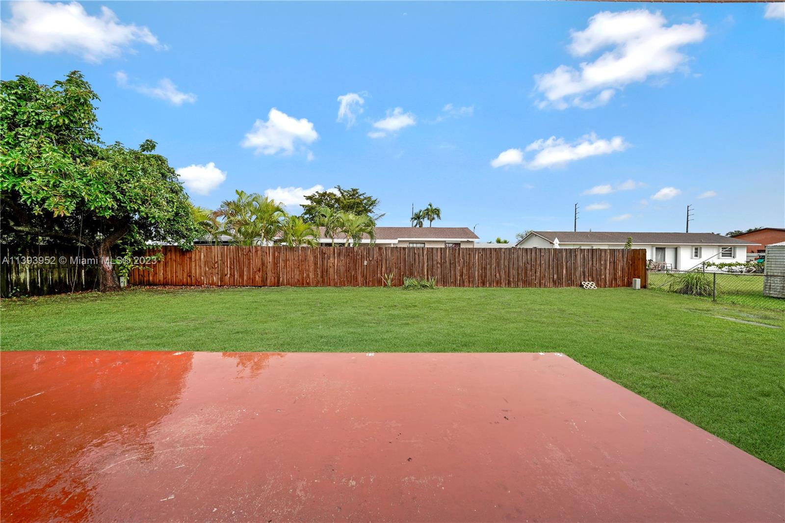 16813 Southwest 107th Place Miami, FL 33157 - Photo 22 of 28 a view of yard with swimming pool and green space