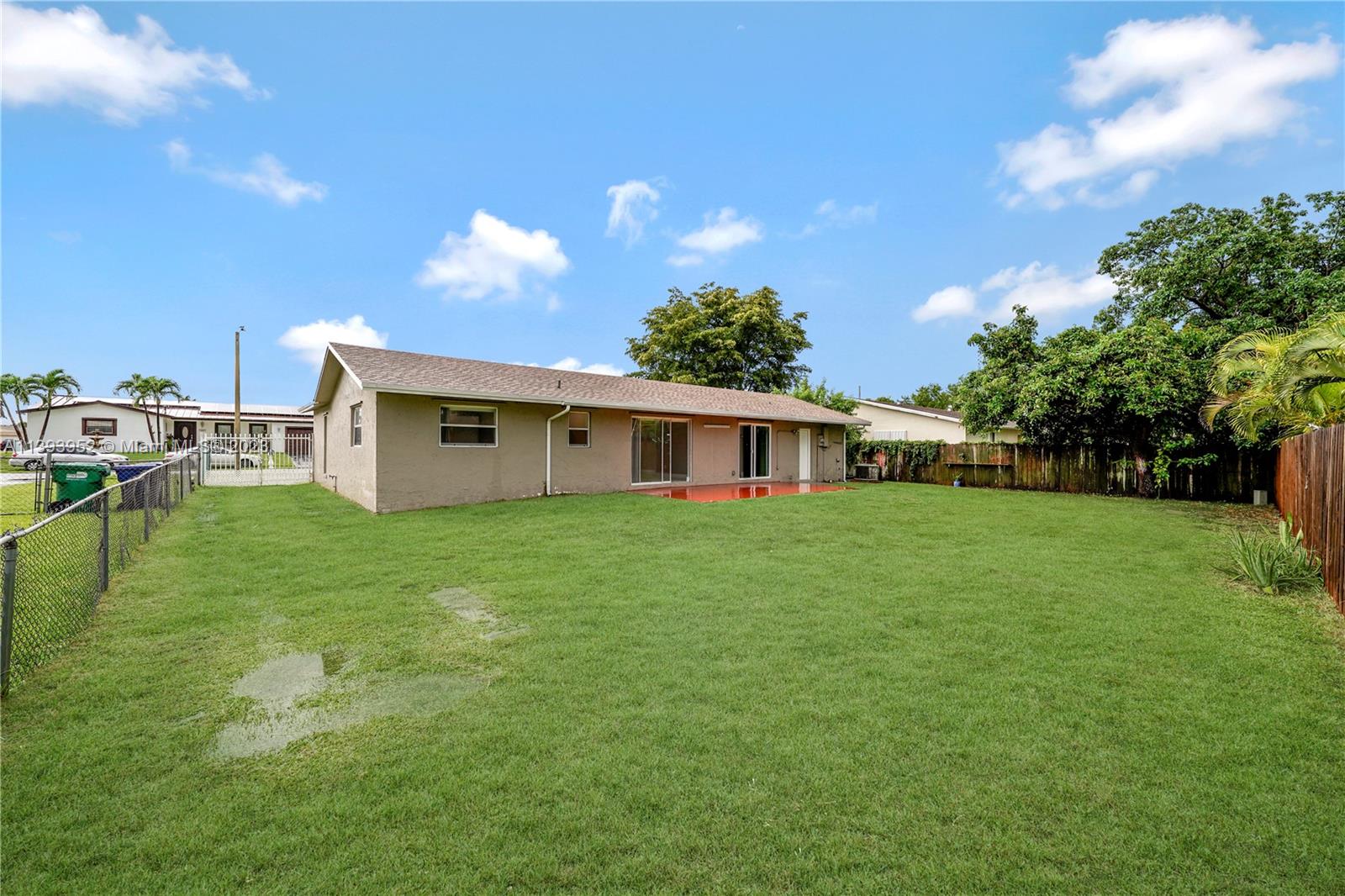 16813 Southwest 107th Place Miami, FL 33157 - Photo 23 of 28 a front view of a house with garden