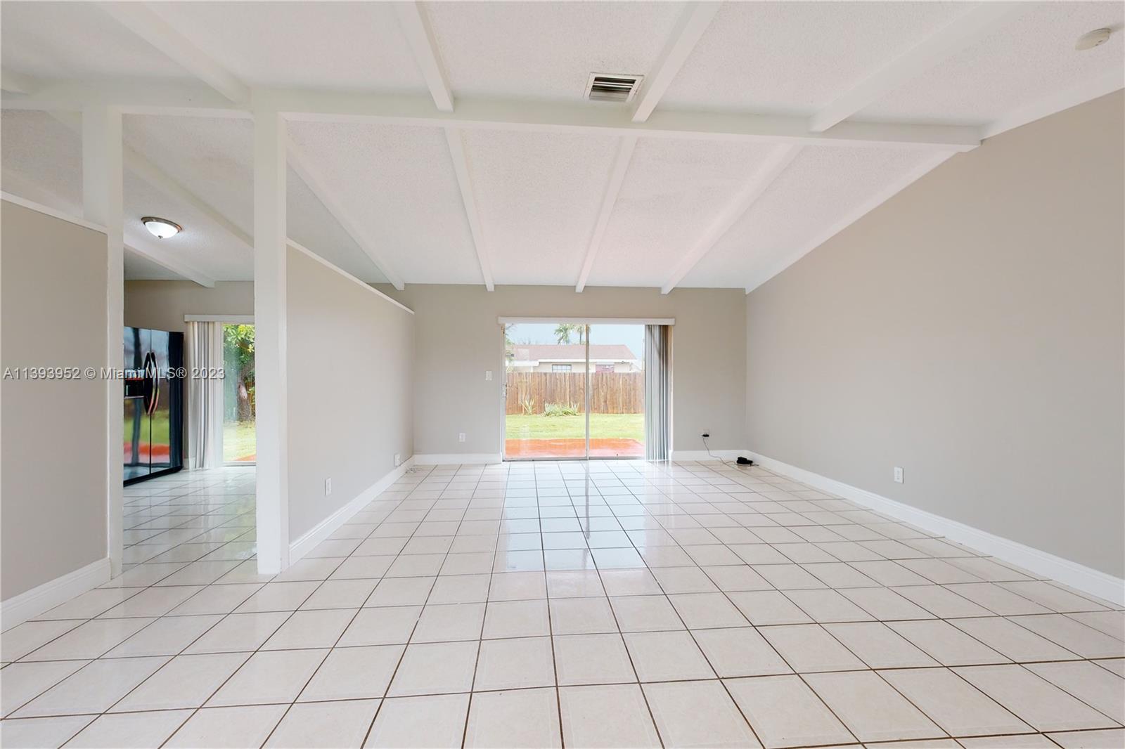16813 Southwest 107th Place Miami, FL 33157 - Photo 5 of 28 a view of an empty room and window