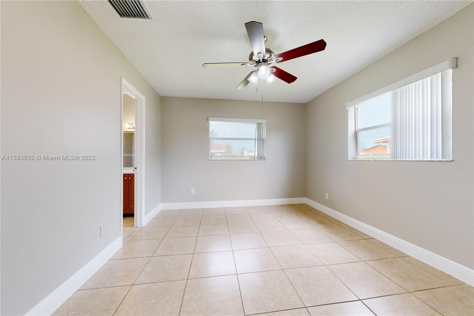 16813 Southwest 107th Place Miami, FL 33157 - Photo 10 of 28 a view of an empty room with a window