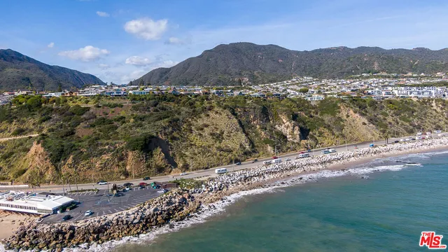 a view of a city with mountains in the background