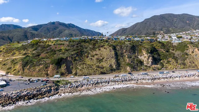 a view of a yard with mountains