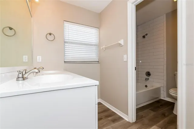 a bathroom with a sink a mirror and a bathtub