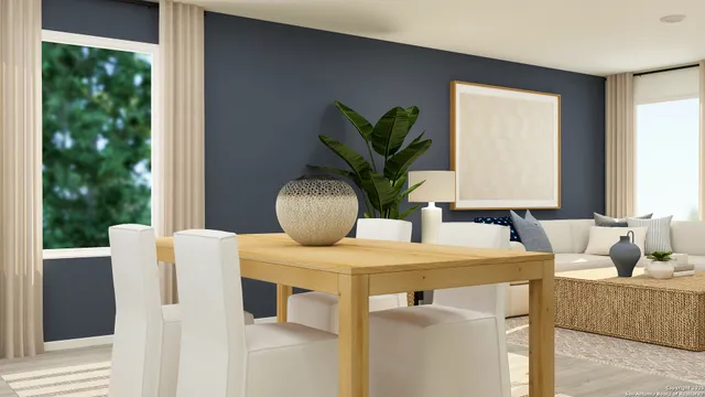 a living room with furniture and potted plant