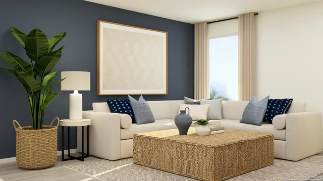 a living room with furniture and a potted plant