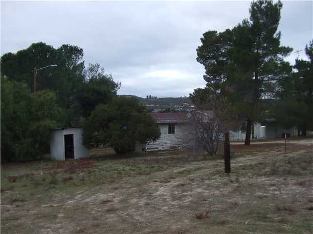 2071 Buckman Springs Road Campo, CA 91906 - Photo 7 of 11 from the center of 10 acres looking toward house Garden Shed on left workman quarters Center