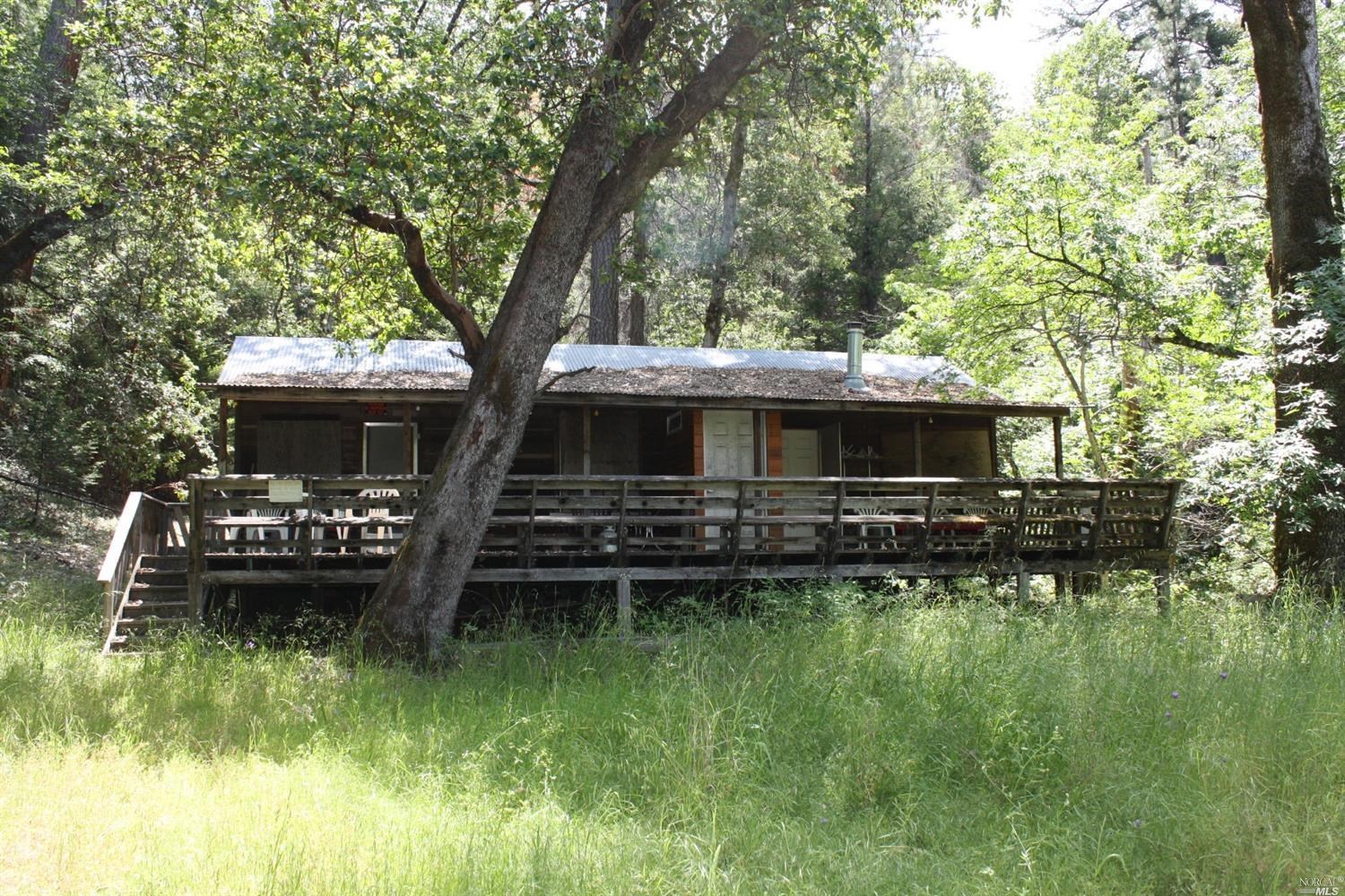 0 Williams Creek Road Covelo, CA 95428 - Photo 1 of 40 a front view of house with yard and outdoor seating