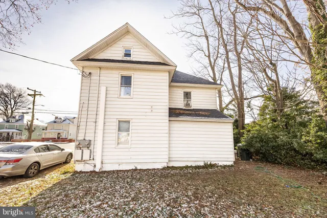 a view of a white house with a large windows